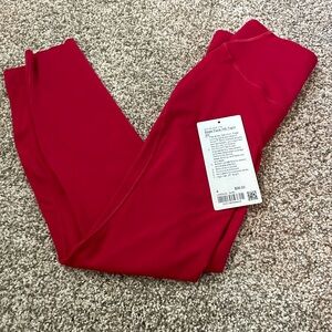 NWOT attached Lululemon Women’s Red Base Pace HR Tight 25”. Never worn.